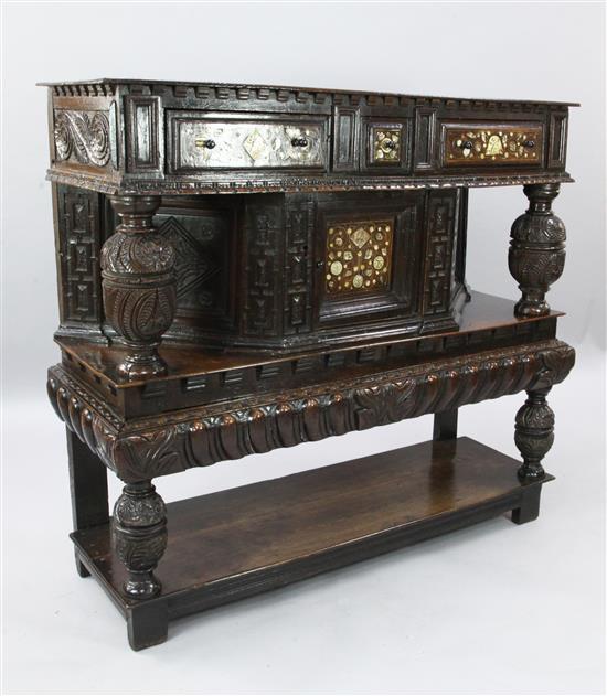 A 17th century style inlaid oak court cupboard, W.4ft 2in. D.1ft 4in. H.3ft 10in.